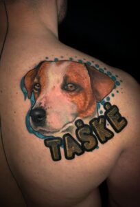 Dog face tattoo on the back