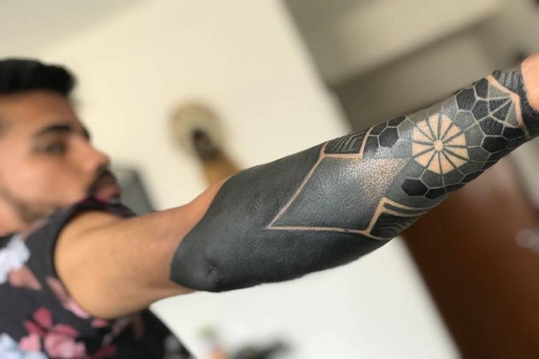 Why Are Blackout Tattoos Trending?