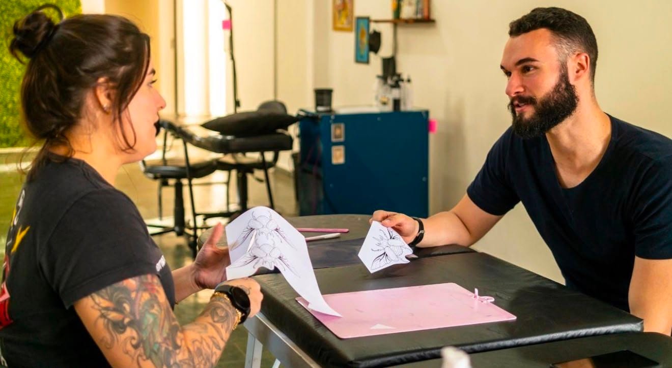 Tattoo artist providing tattoo aftercare advice at Inkredible Tattoo Studio Sheffield.